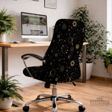 Black chair cover with a gold astrology print of moons, suns, stars, and symbols on a gaming chair.