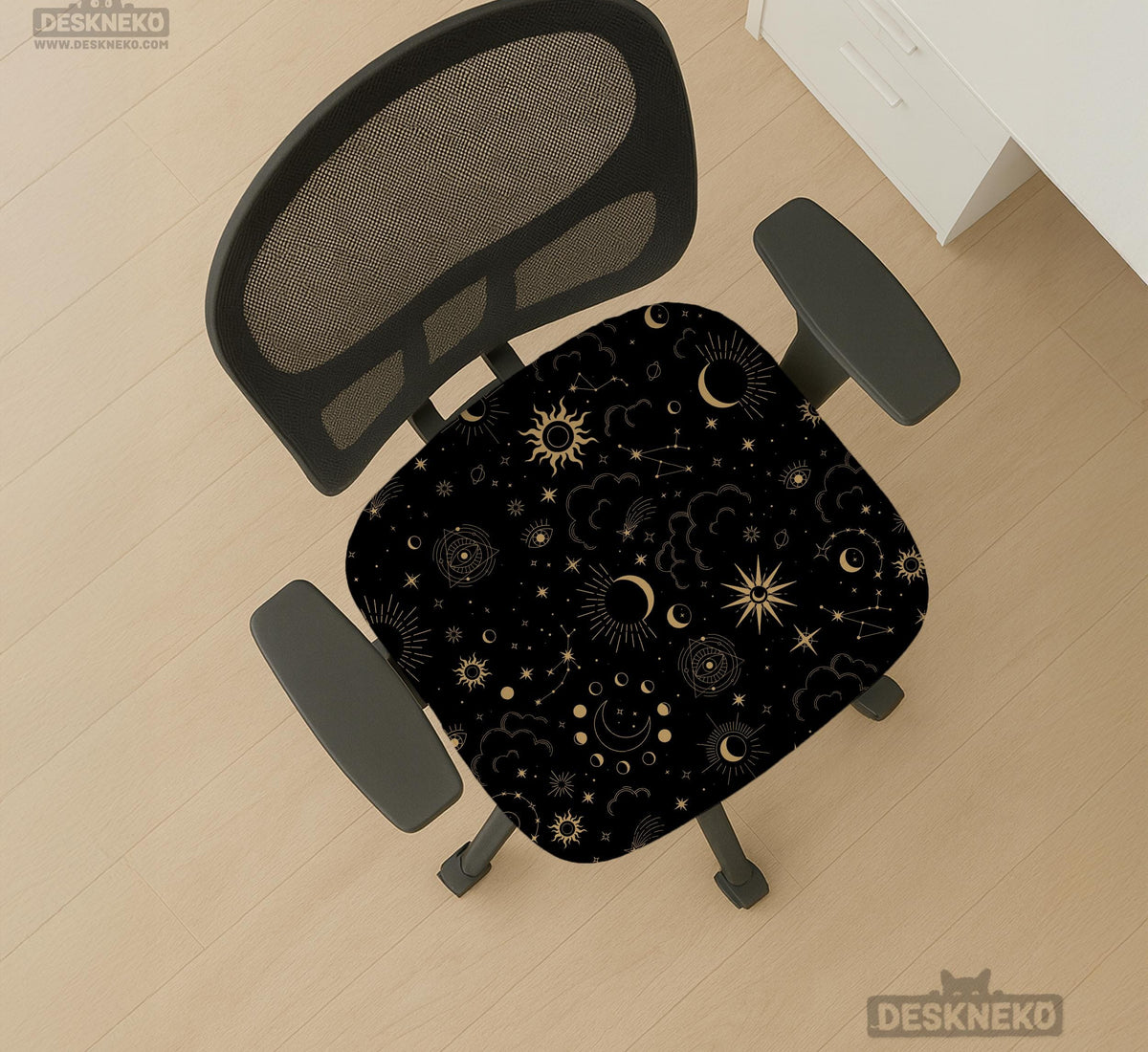Black chair cover with gold moons, suns, stars, constellations, and line art printed across the fabric.