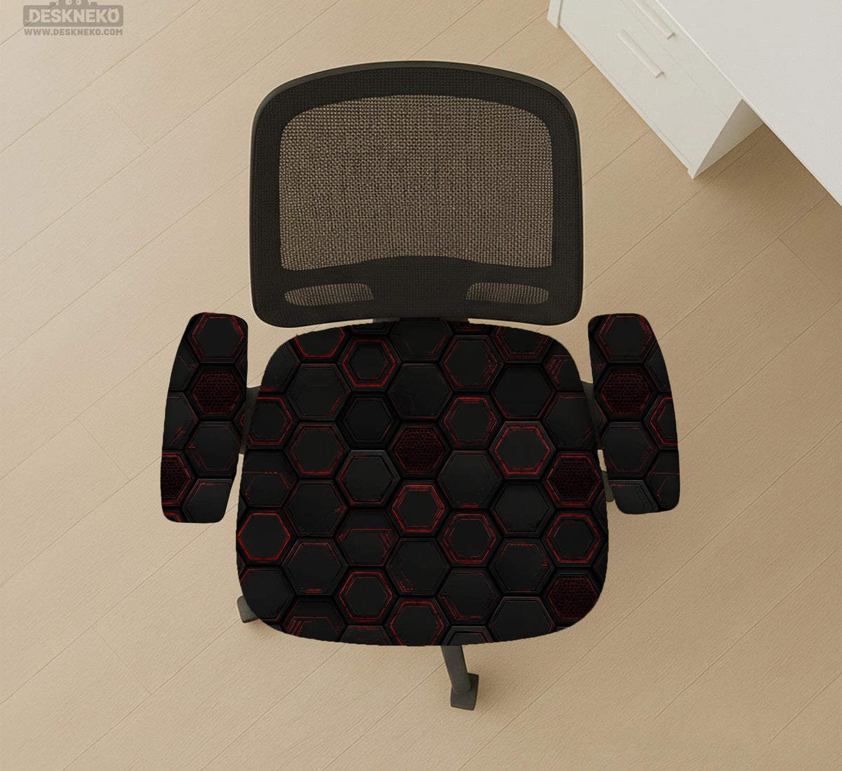 Black chair cover with a dark red geometric pattern shown on an office chair, with a fitted stretch look.