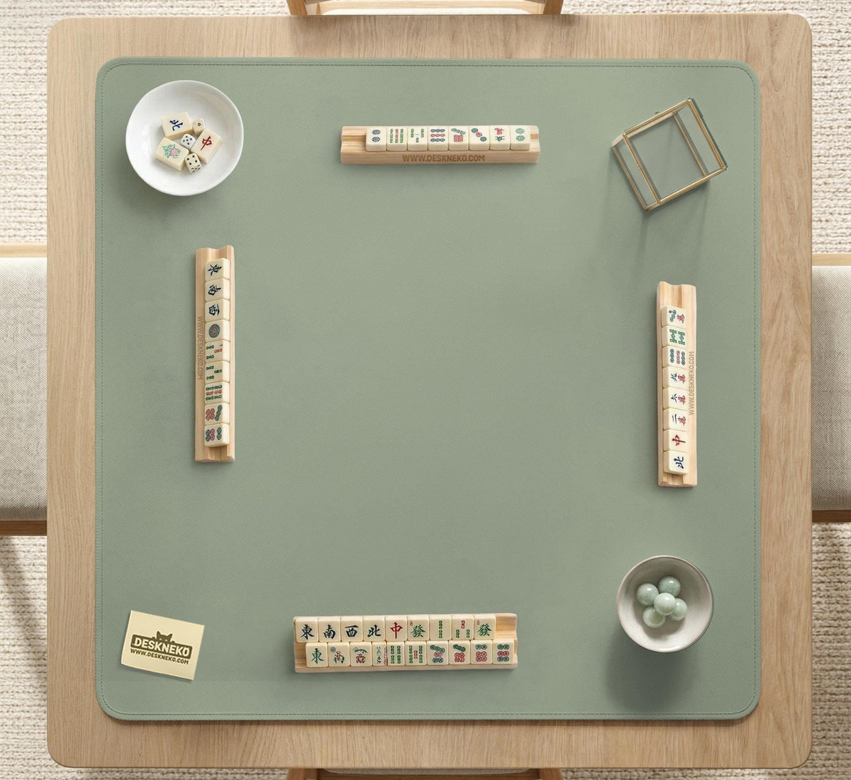 A plain light sage green square mahjong mat with a smooth solid-color surface.