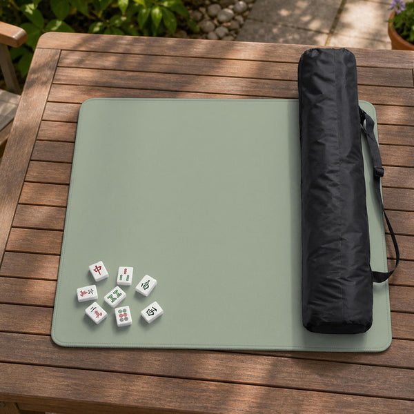 A plain light sage green square mahjong mat with a smooth solid-color surface.
