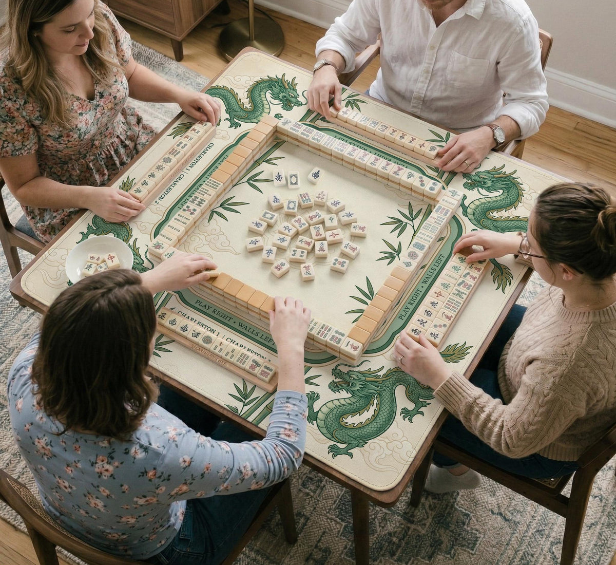 Sage green mahjong mat with a bamboo pattern, dragon design, printed rules around the edge, and a scalloped edge option.