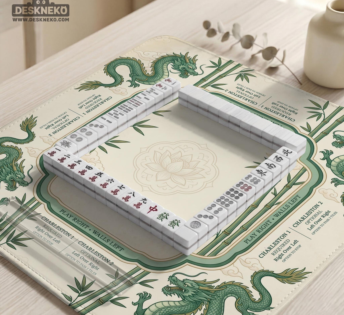 Sage green mahjong mat with a bamboo pattern, dragon design, printed rules around the edge, and a scalloped edge option.