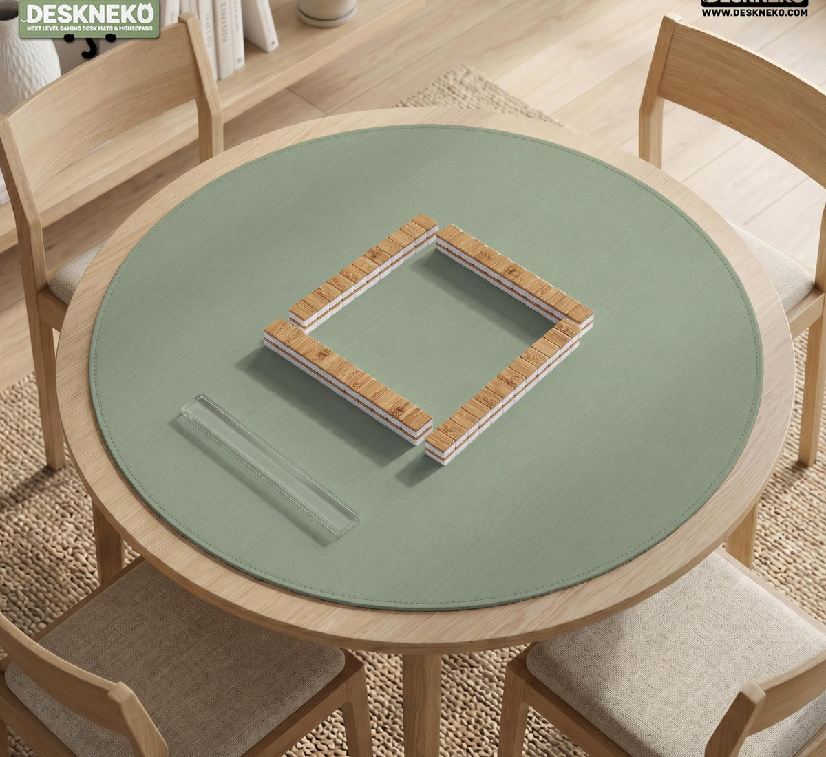 A square sage green mahjong mat with scalloped edges on a plain background.