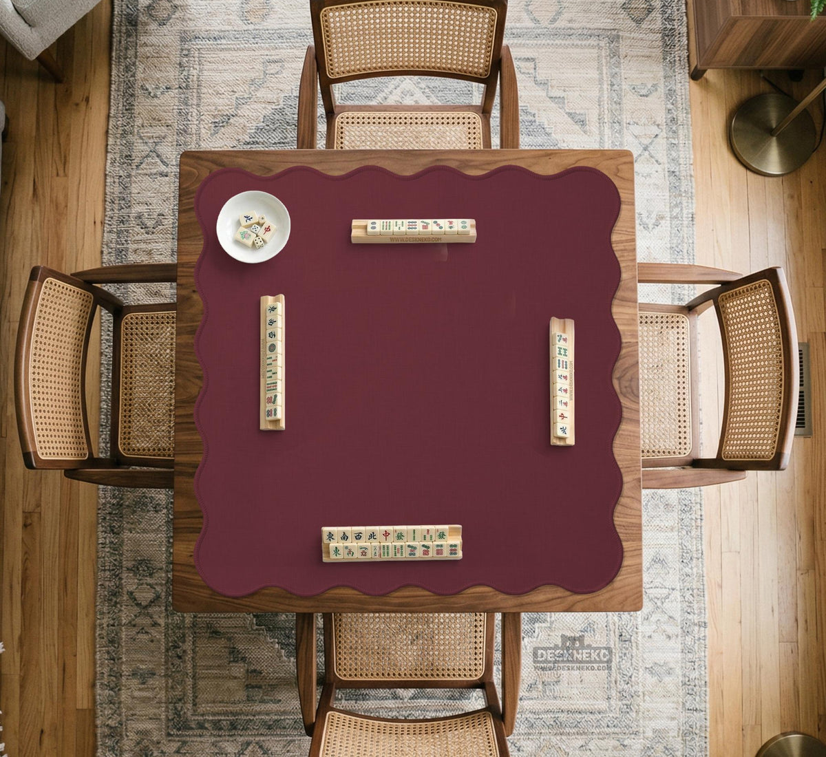 Plain burgundy square mahjong mat with scalloped edges on a white background.