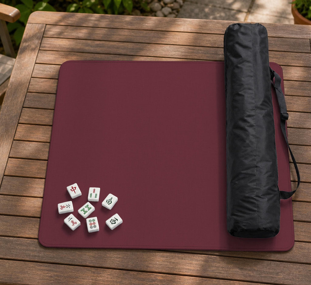 Plain burgundy square mahjong mat with scalloped edges on a white background.