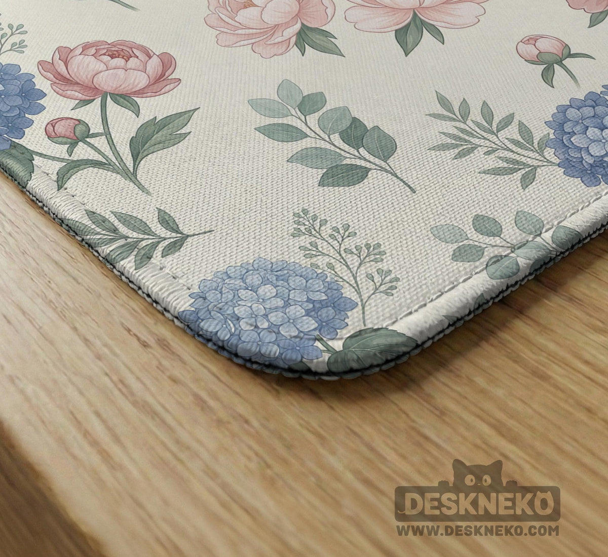 Pink floral mahjong table mat with peonies, blue hydrangeas, sage green leaves, and an ivory background.