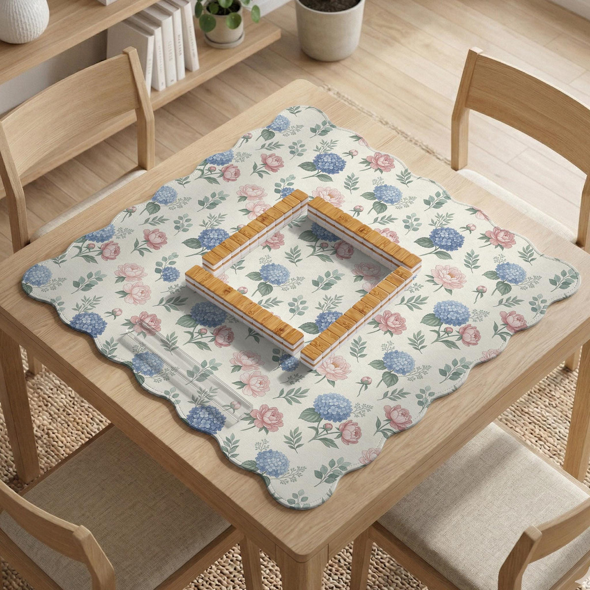 Pink floral mahjong table mat with peonies, blue hydrangeas, sage green leaves, and an ivory background.