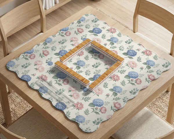 Pink floral mahjong table mat with peonies, blue hydrangeas, sage green leaves, and an ivory background.