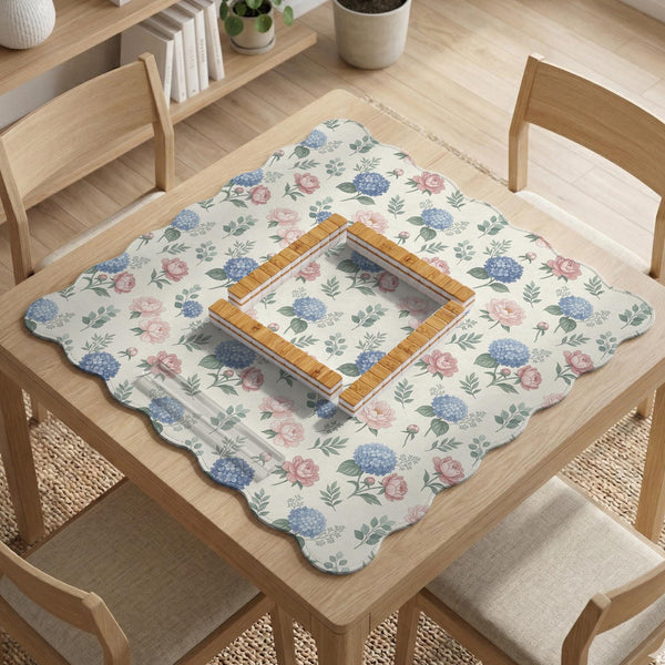 Pink floral mahjong table mat with peonies, blue hydrangeas, sage green leaves, and an ivory background.