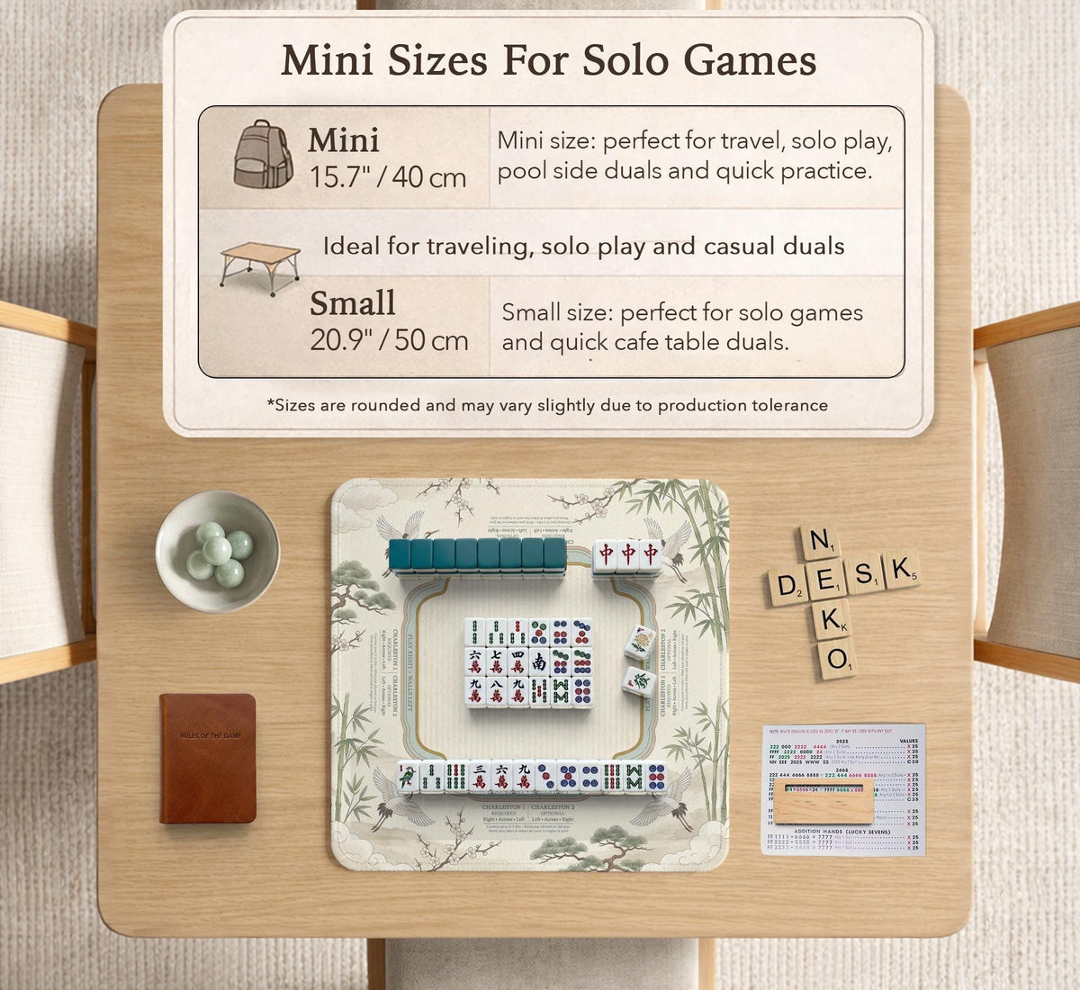 Sage green scalloped mahjong mat with bamboo, crane, and blossom illustration and printed rules around the border.