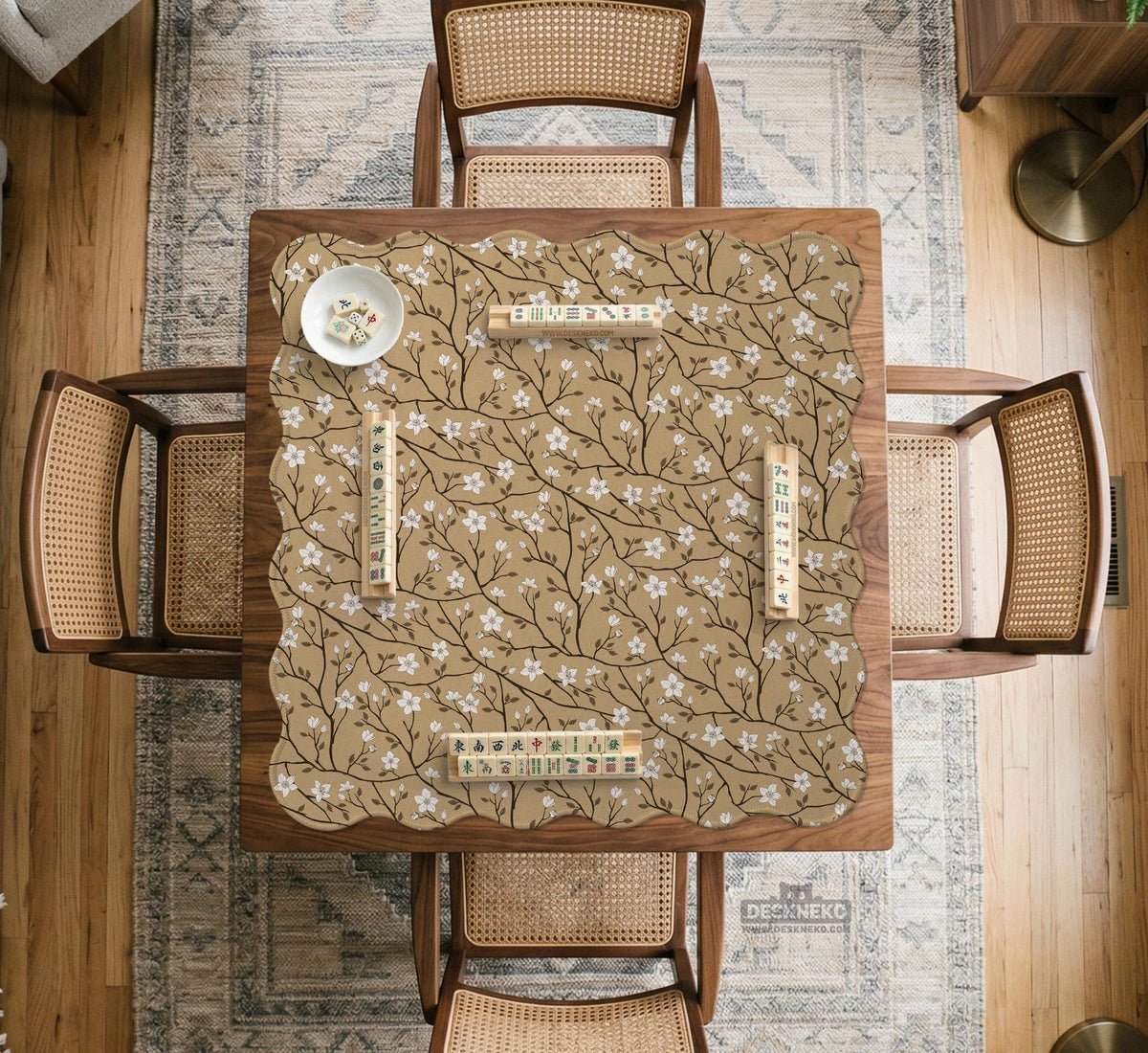 Beige mahjong mat with a white blossom branch floral pattern on a neutral background.