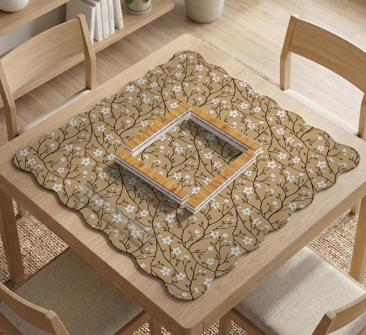Beige mahjong mat with a white blossom branch floral pattern on a neutral background.