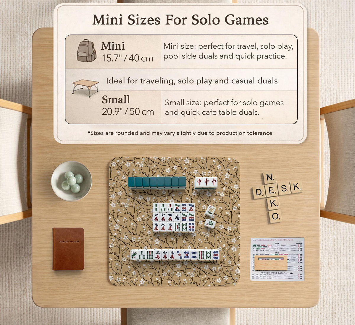 Beige mahjong mat with a white blossom branch floral pattern on a neutral background.