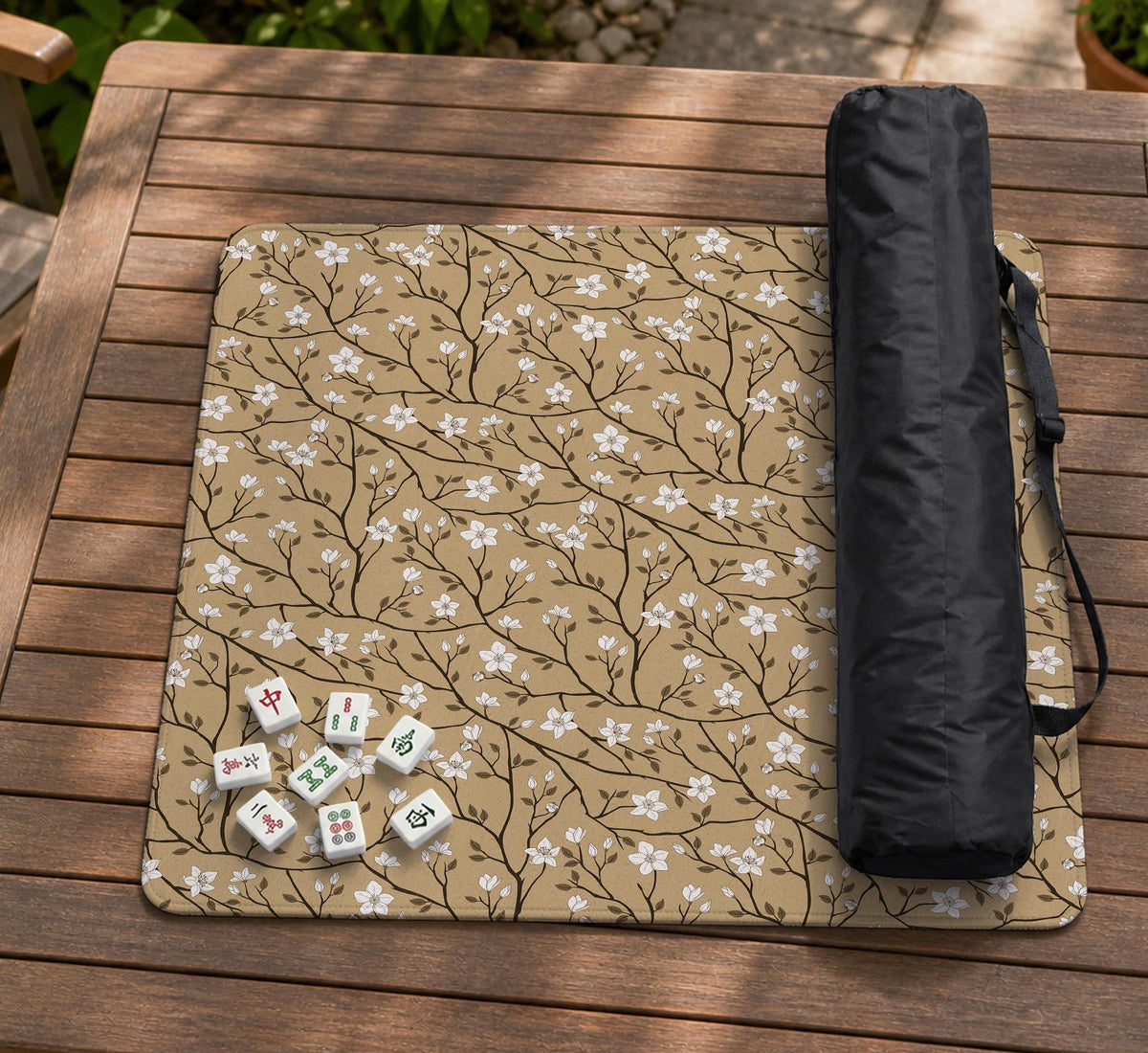 Beige mahjong mat with a white blossom branch floral pattern on a neutral background.