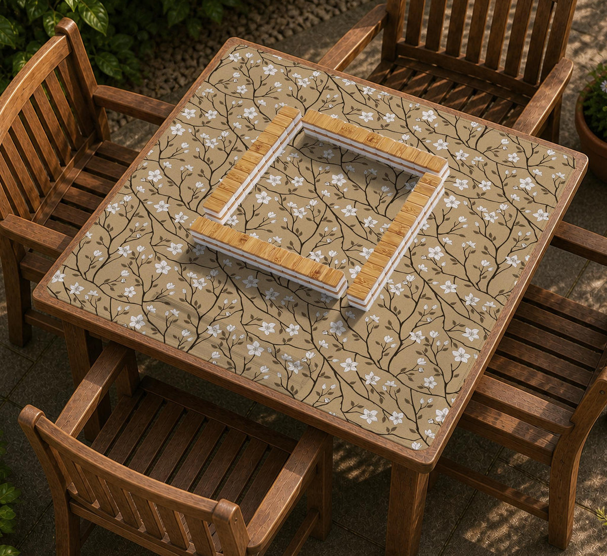 Beige mahjong mat with a white blossom branch floral pattern on a neutral background.