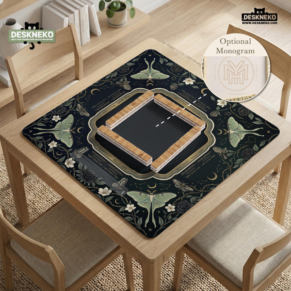 A dark floral mahjong mat with a scalloped edge, moth and flower artwork, and an American Mahjong rules layout on a dark background.
