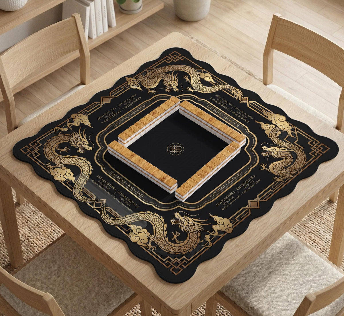 Black mahjong mat with gold dragon artwork, a scalloped edge, and printed Mahjong rules on the surface.