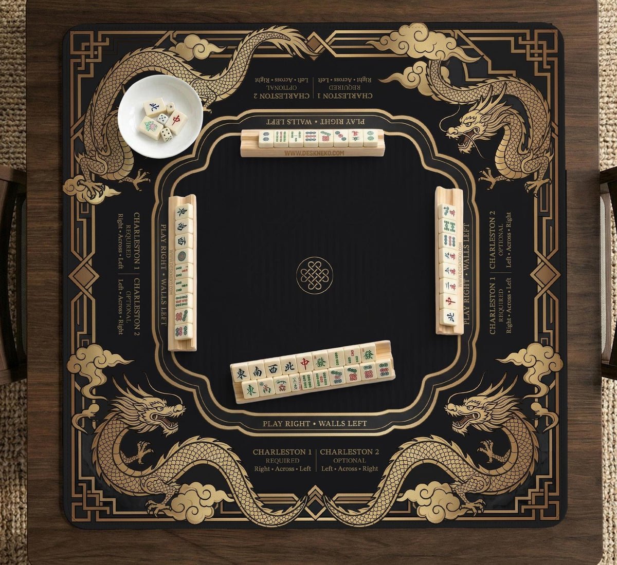Black mahjong mat with gold dragon artwork, a scalloped edge, and printed Mahjong rules on the surface.