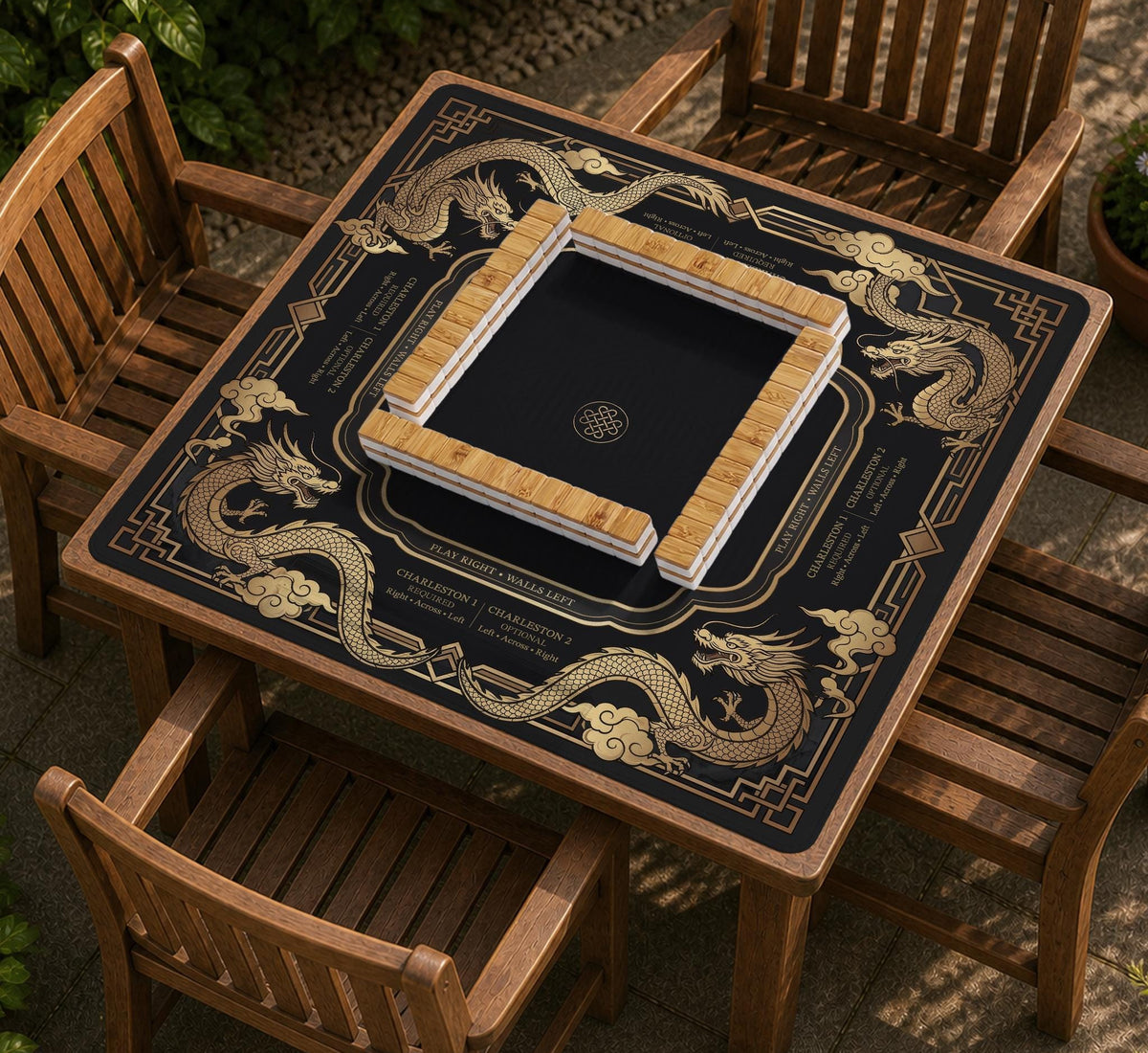 Black mahjong mat with gold dragon artwork, a scalloped edge, and printed Mahjong rules on the surface.