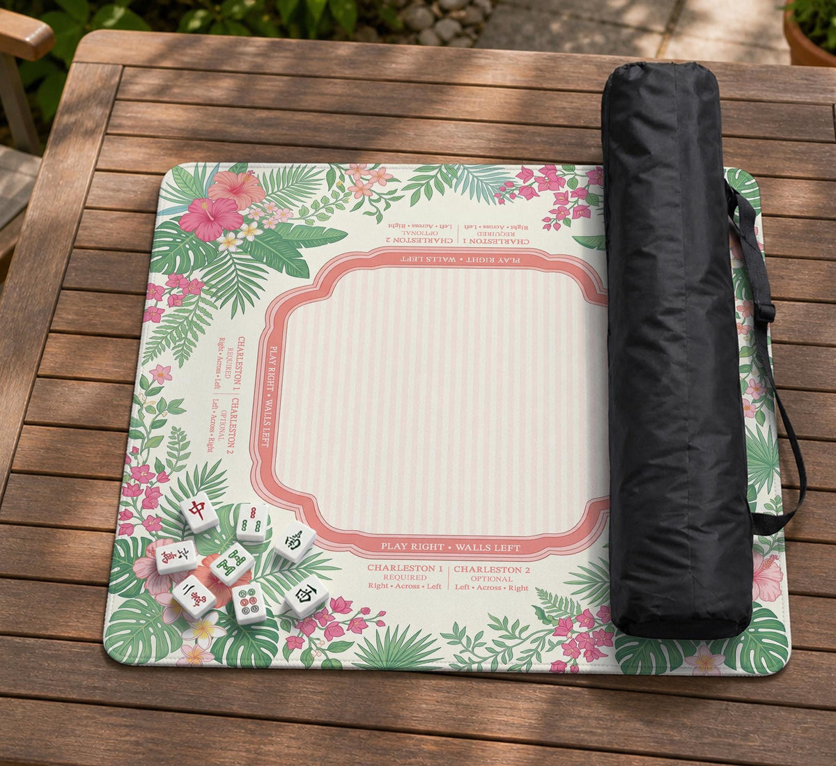Coral tropical floral mahjong mat with hibiscus flowers, palm leaves, cream sections, and a scalloped edge.