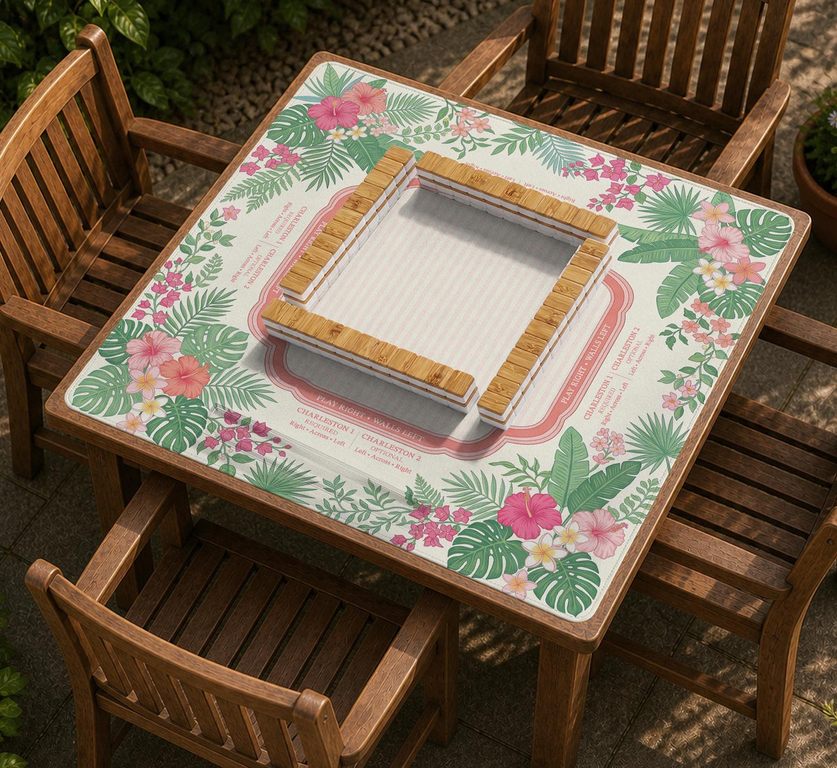 Coral tropical floral mahjong mat with hibiscus flowers, palm leaves, cream sections, and a scalloped edge.