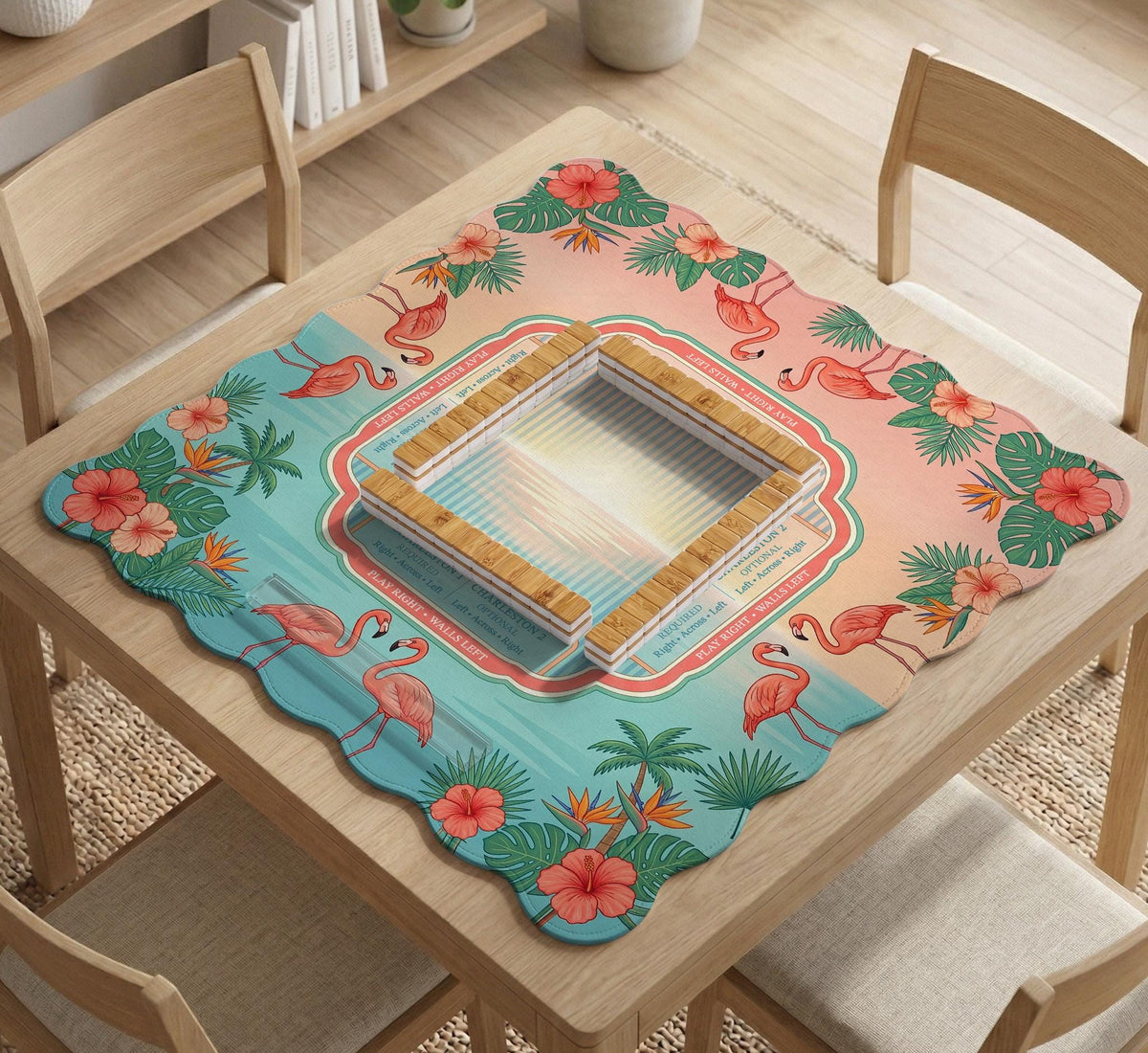 Pink mahjong mat with flamingos, palm leaves, hibiscus flowers, and aqua tropical background.