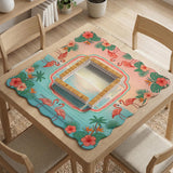 A square mahjong mat with flamingos, hibiscus flowers, palm leaves, and aqua water accents on a coral background with a scalloped edge.