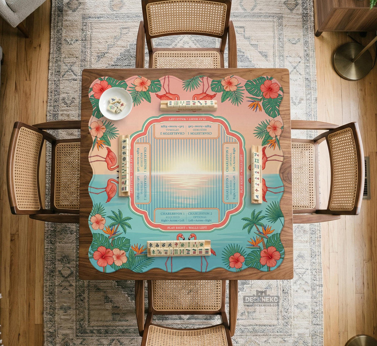 Pink mahjong mat with flamingos, palm leaves, hibiscus flowers, and aqua tropical background.