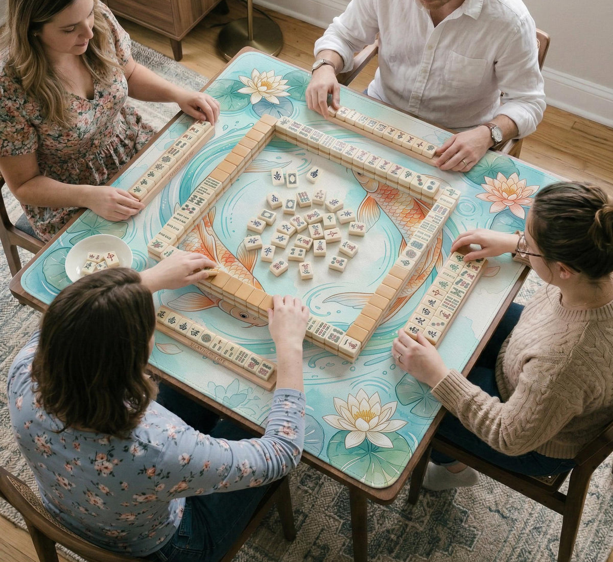 A soft blue mahjong mat with koi fish, floating lily pads, pale floral details, and a watercolor-style pond design.
