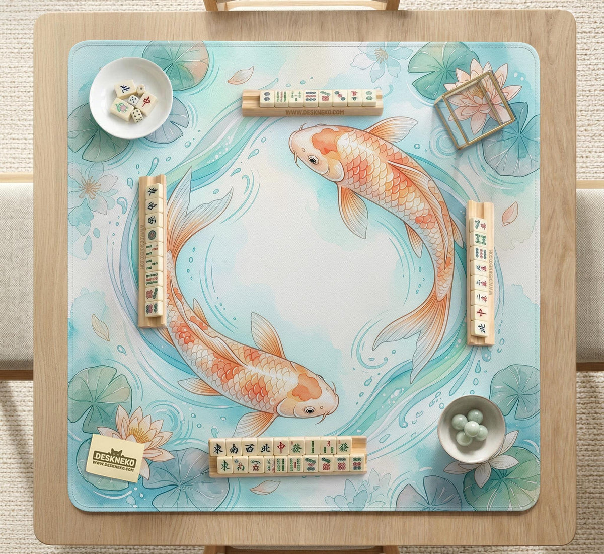A soft blue mahjong mat with koi fish, floating lily pads, pale floral details, and a watercolor-style pond design.