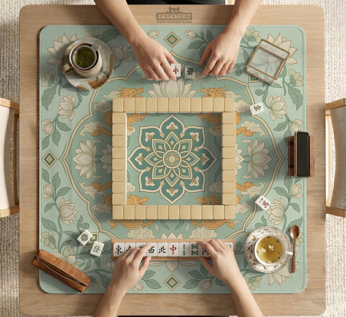 Sage green square mahjong mat with lotus flowers, golden dragons, and an ornamental center design.