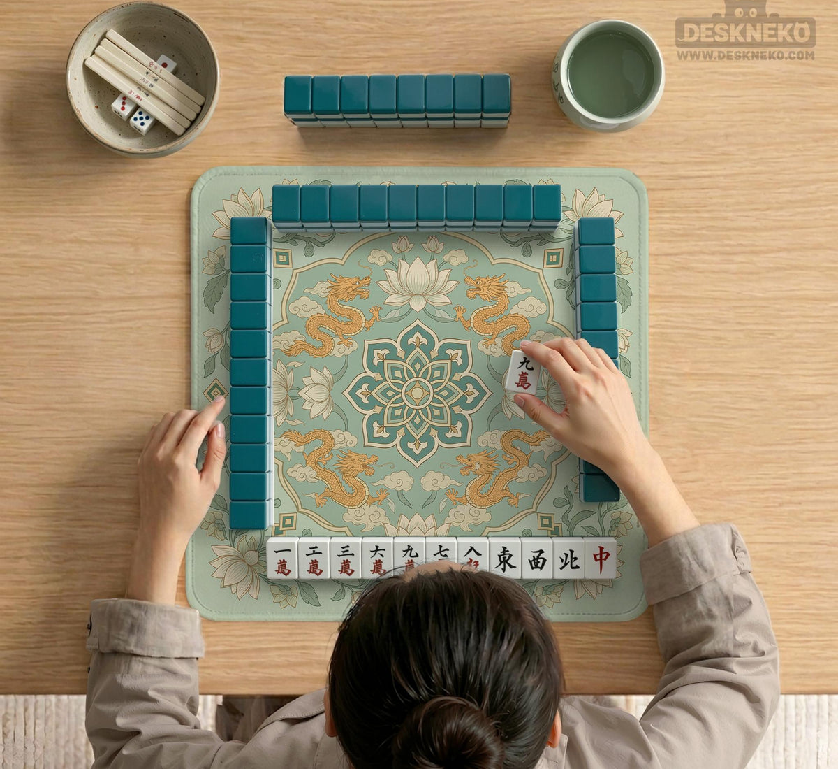 Sage green square mahjong mat with lotus flowers, golden dragons, and an ornamental center design.