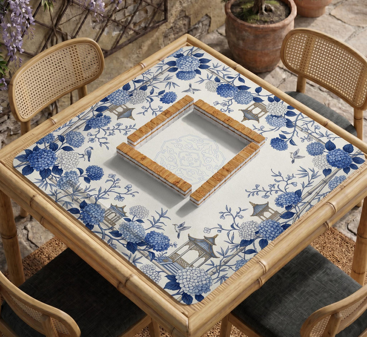 Blue and white square mahjong mat with a hydrangea and bird botanical border and a plain center area.