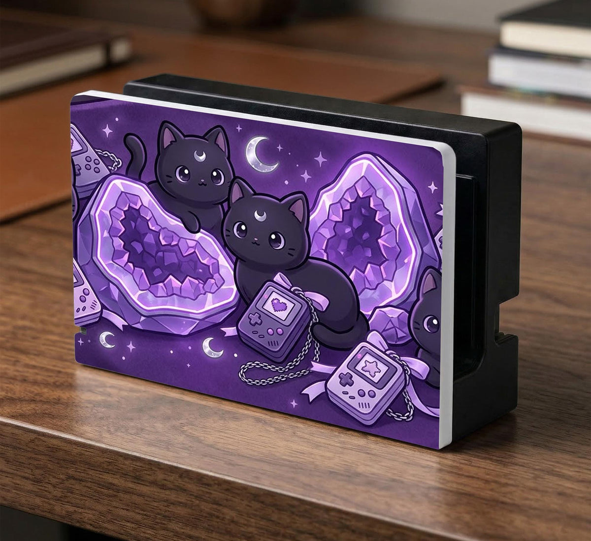 Purple carrying case with black cat faces, moon shapes, stars, and crystal geode style artwork for Nintendo Switch.