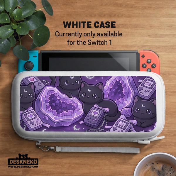 Purple carrying case with black cat faces, moon shapes, stars, and crystal geode style artwork for Nintendo Switch.
