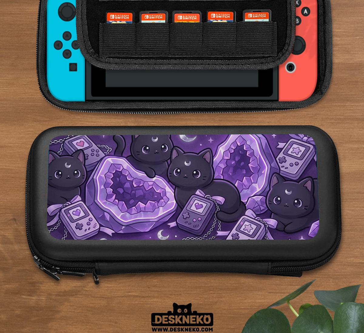 Purple carrying case with black cat faces, moon shapes, stars, and crystal geode style artwork for Nintendo Switch.