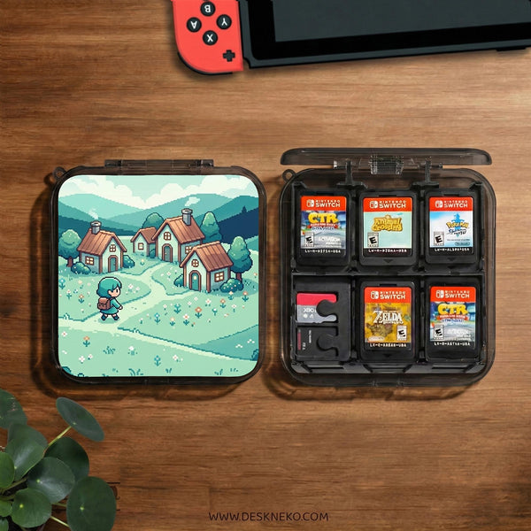 Teal carrying case with a pixel-style village scene, small houses, layered mountains, flowers, and a retro game-inspired landscape design.
