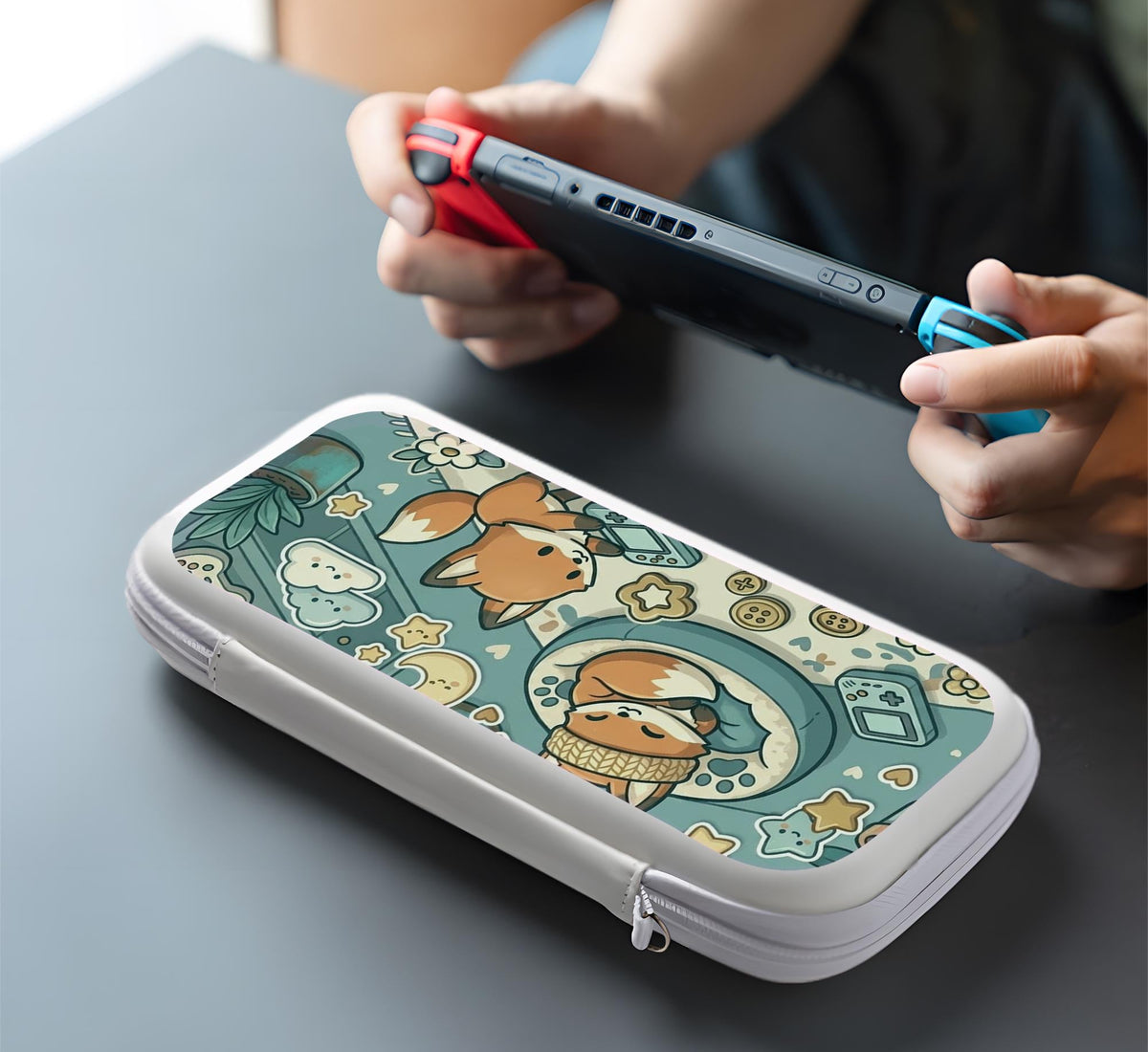 Blue Switch carrying case with cute fox characters, moon and star details, and small potted plants with beige accents.