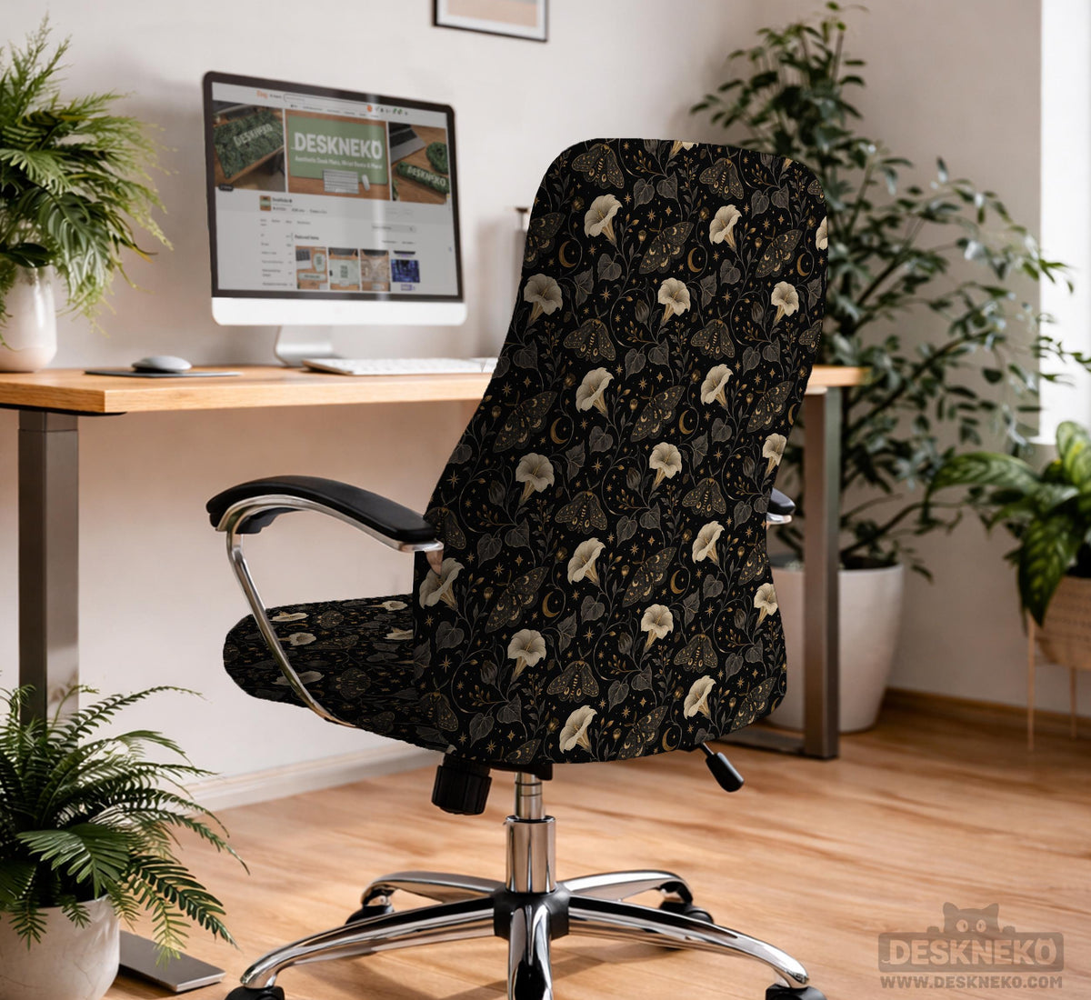 Black chair cover with a moth, moon, and flower pattern in gold, ivory, and dark botanical tones.