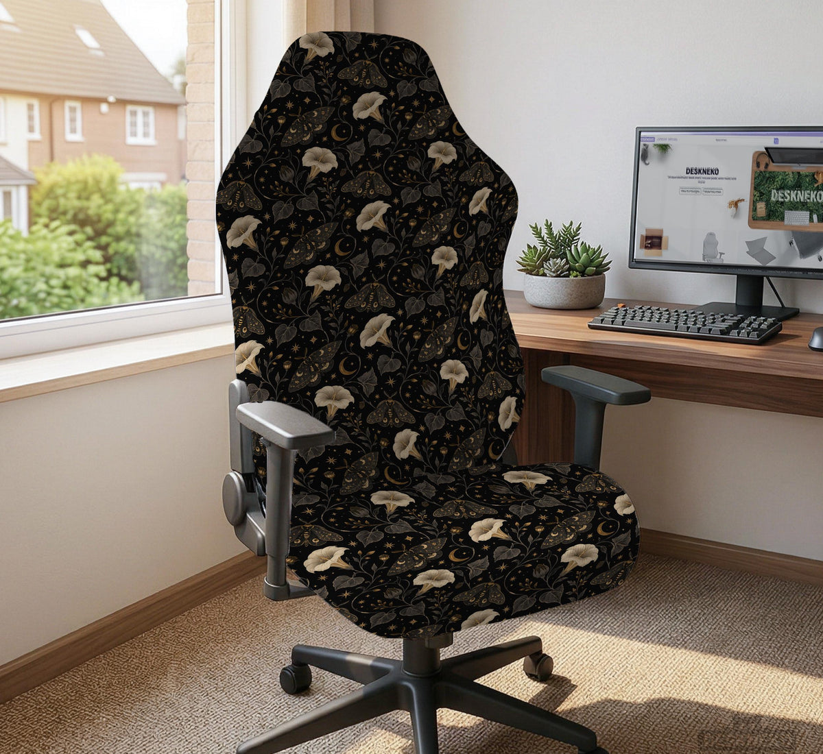 Black chair cover with a moth, moon, and flower pattern in gold, ivory, and dark botanical tones.