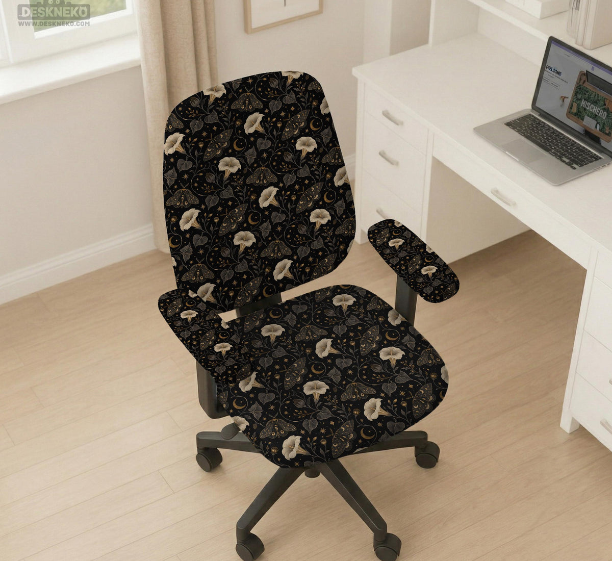 Black chair cover with a moth, moon, and flower pattern in gold, ivory, and dark botanical tones.