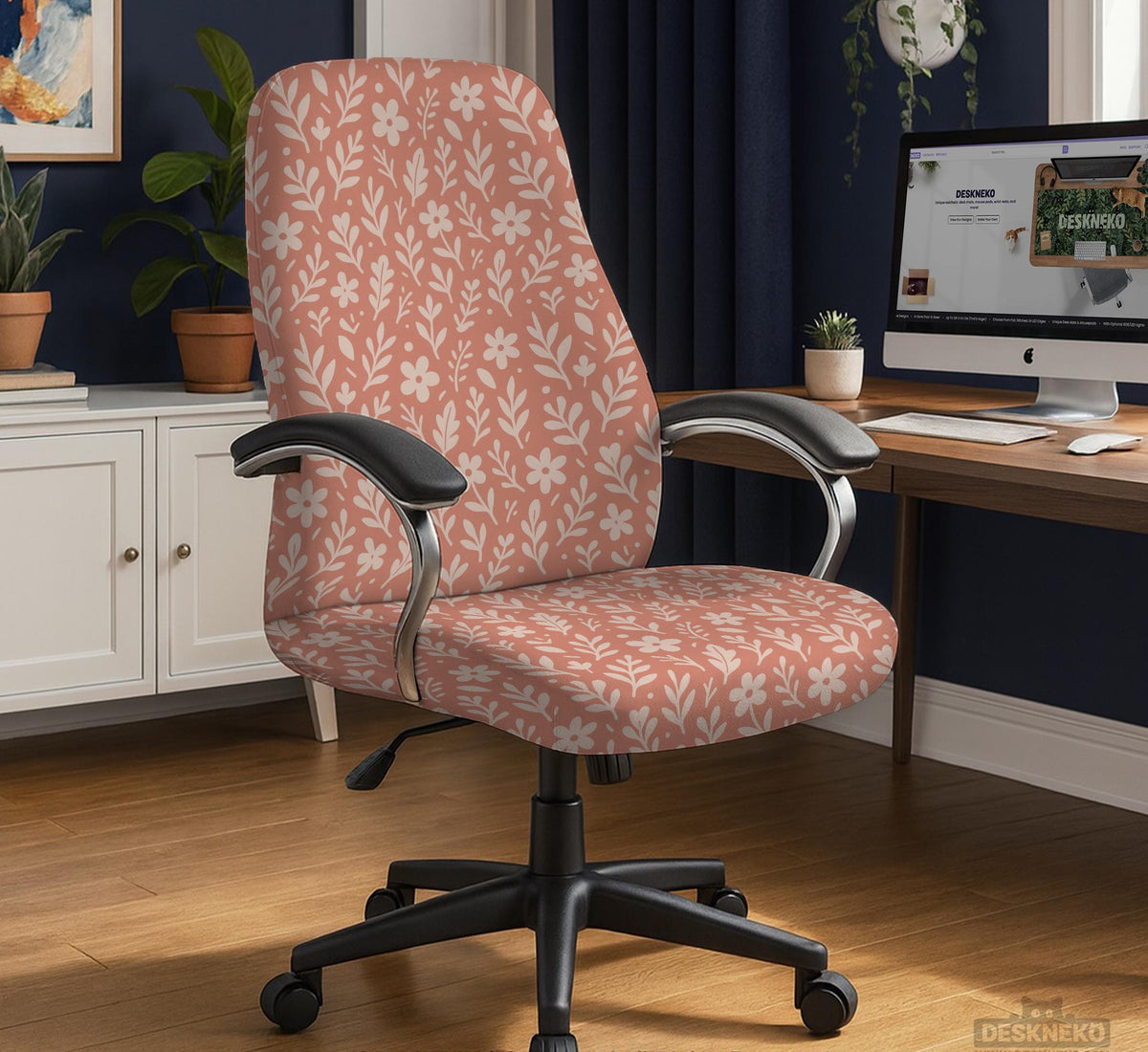 Pink chair cover with a botanical floral print shown on an office chair, with matching armrest covers and multiple cover style options.