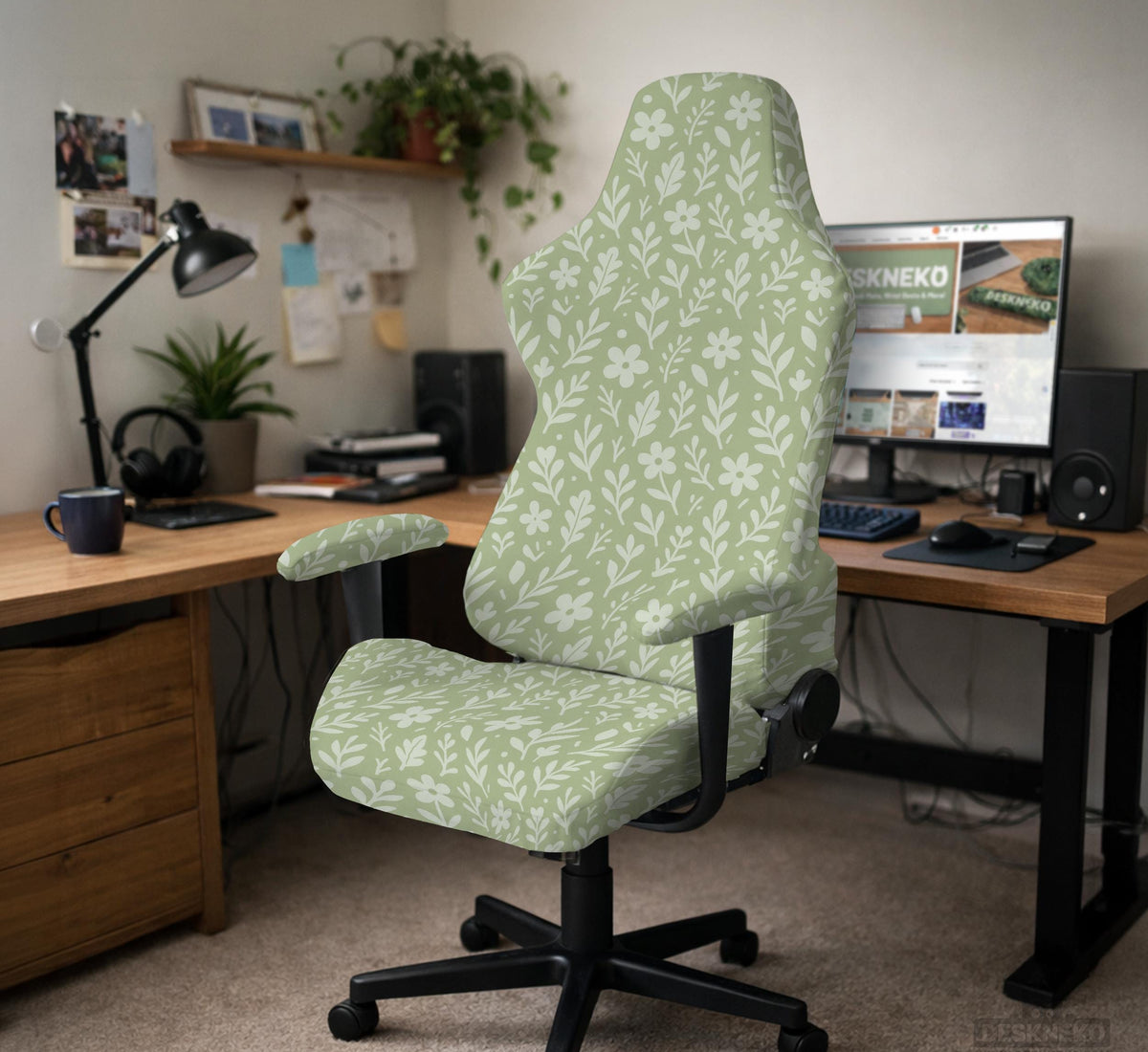 Sage green desk chair cover with a small floral and leaf print shown on an office chair.