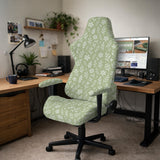 Sage green desk chair cover with a small floral and leaf print shown on an office chair.