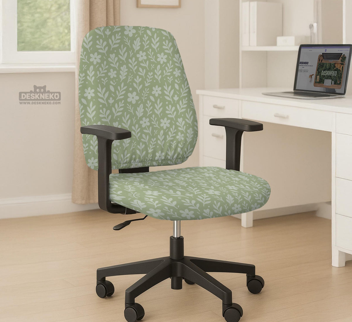 Green chair cover with a small botanical floral print in sage and cream.