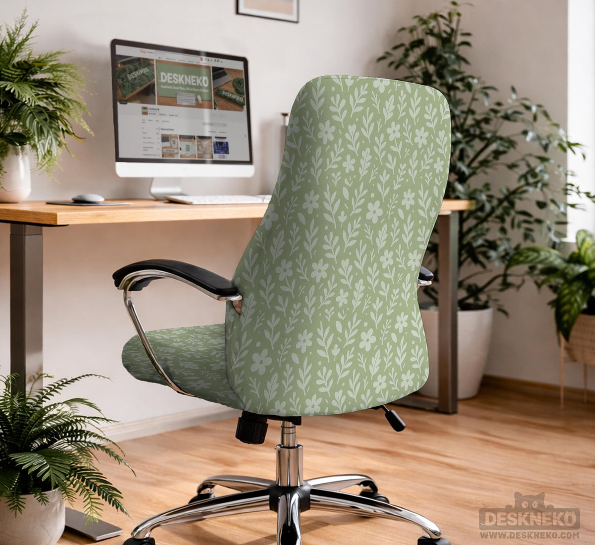 Sage green desk chair cover with a small floral and leaf print shown on an office chair.
