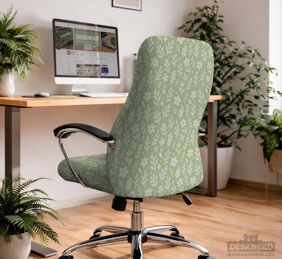Green chair cover with a small botanical floral print in sage and cream.