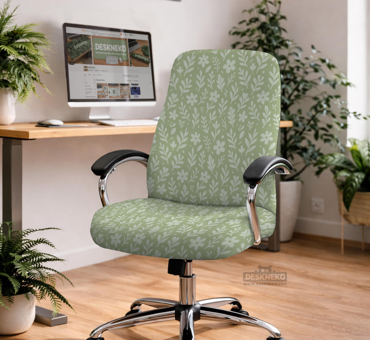 Green chair cover with a small botanical floral print in sage and cream.
