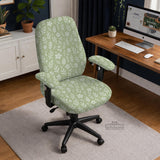 Sage green desk chair cover with a small floral and leaf print shown on an office chair.